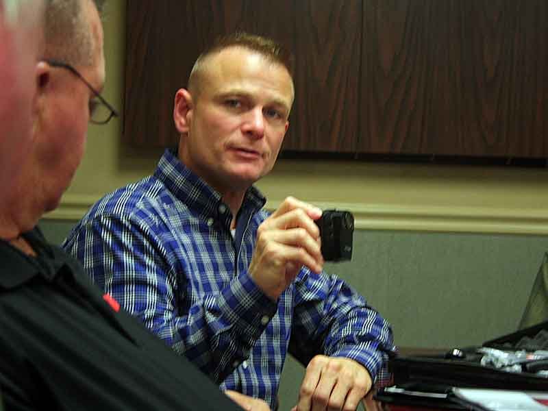Chief McCubbin demonstrates officer body cameras to safety committee